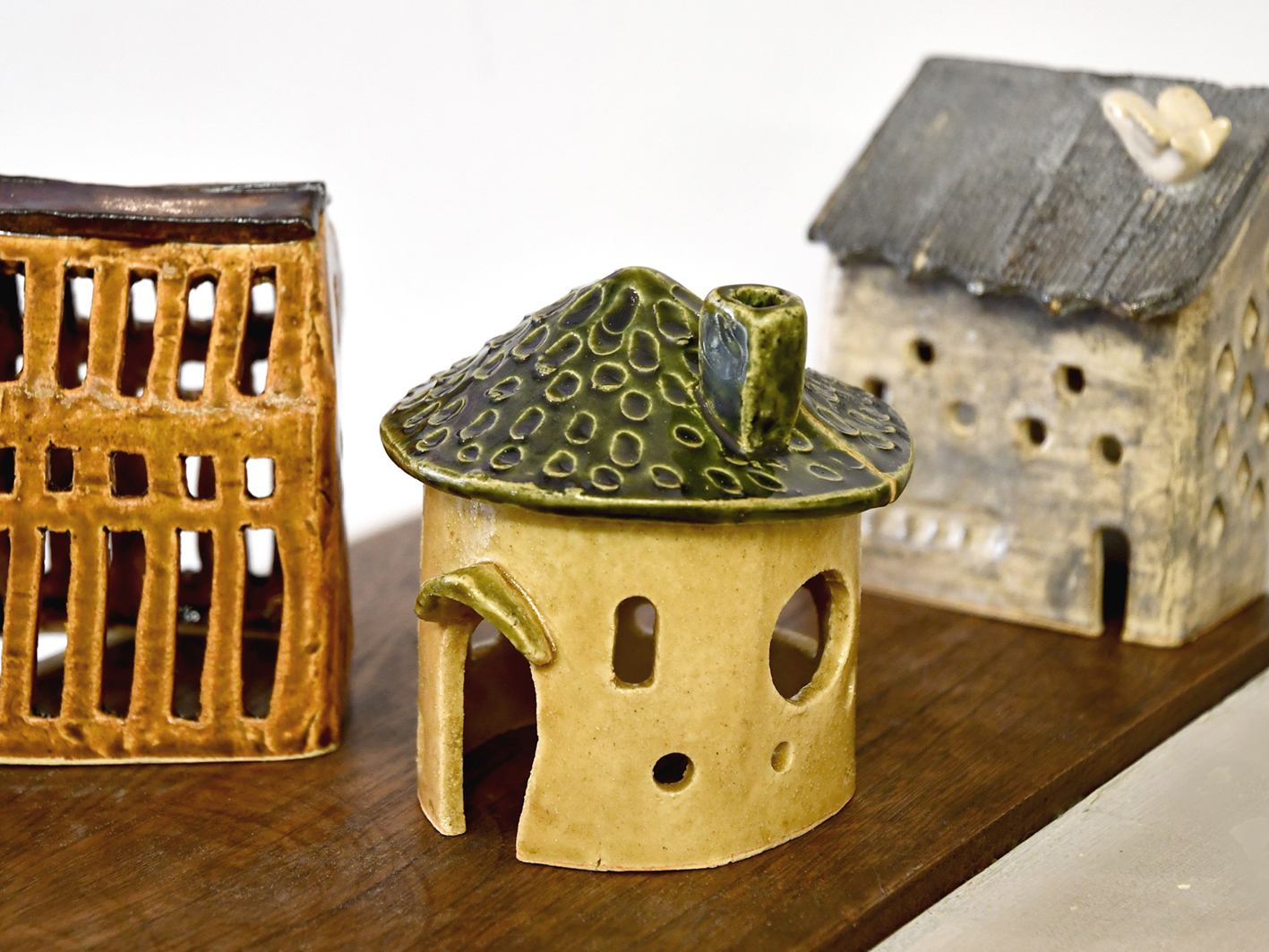 Lighten up your home with your hand-made house-shaped candle cover!